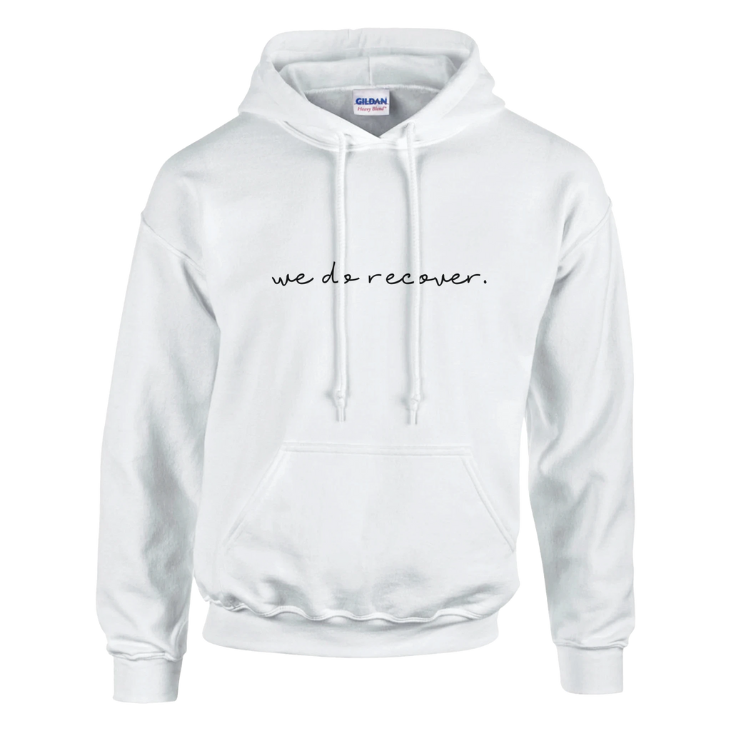 White hoodie with black handwritten text that reads “we do recover.” symbolizing hope, resilience, and strength in recovery