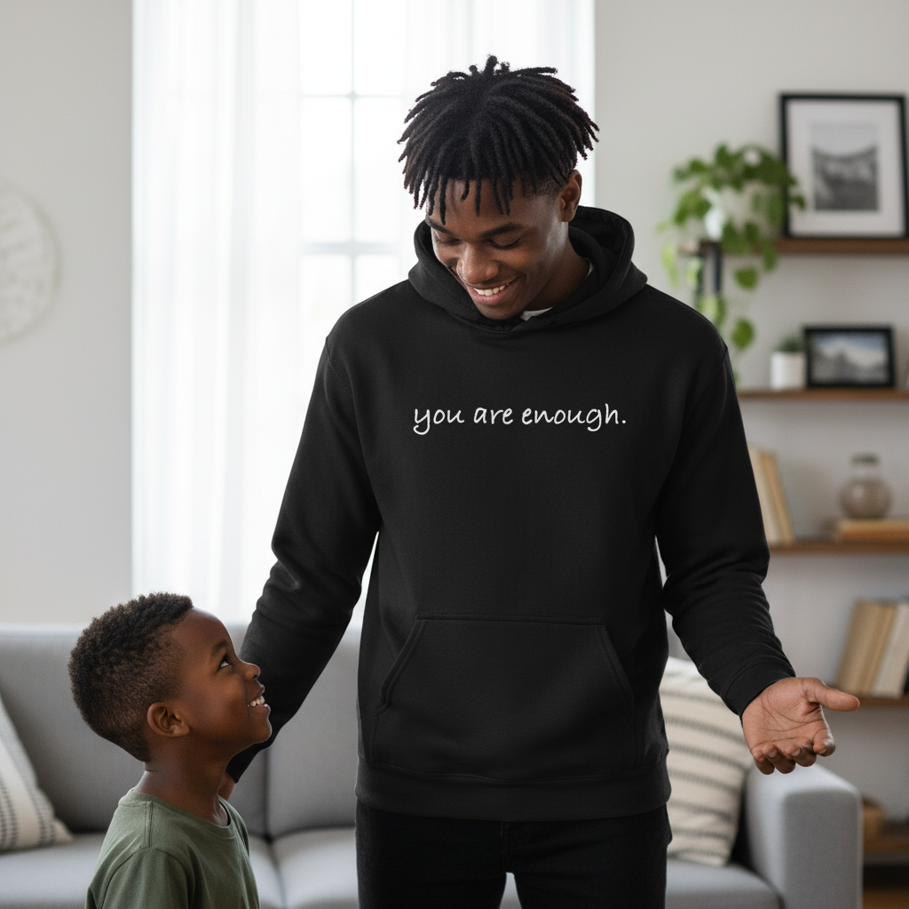 Black hoodie with the inspirational phrase “you are enough.” A cozy and empowering sweatshirt reminding you of self-worth and confidence, perfect for everyday motivation and comfort.